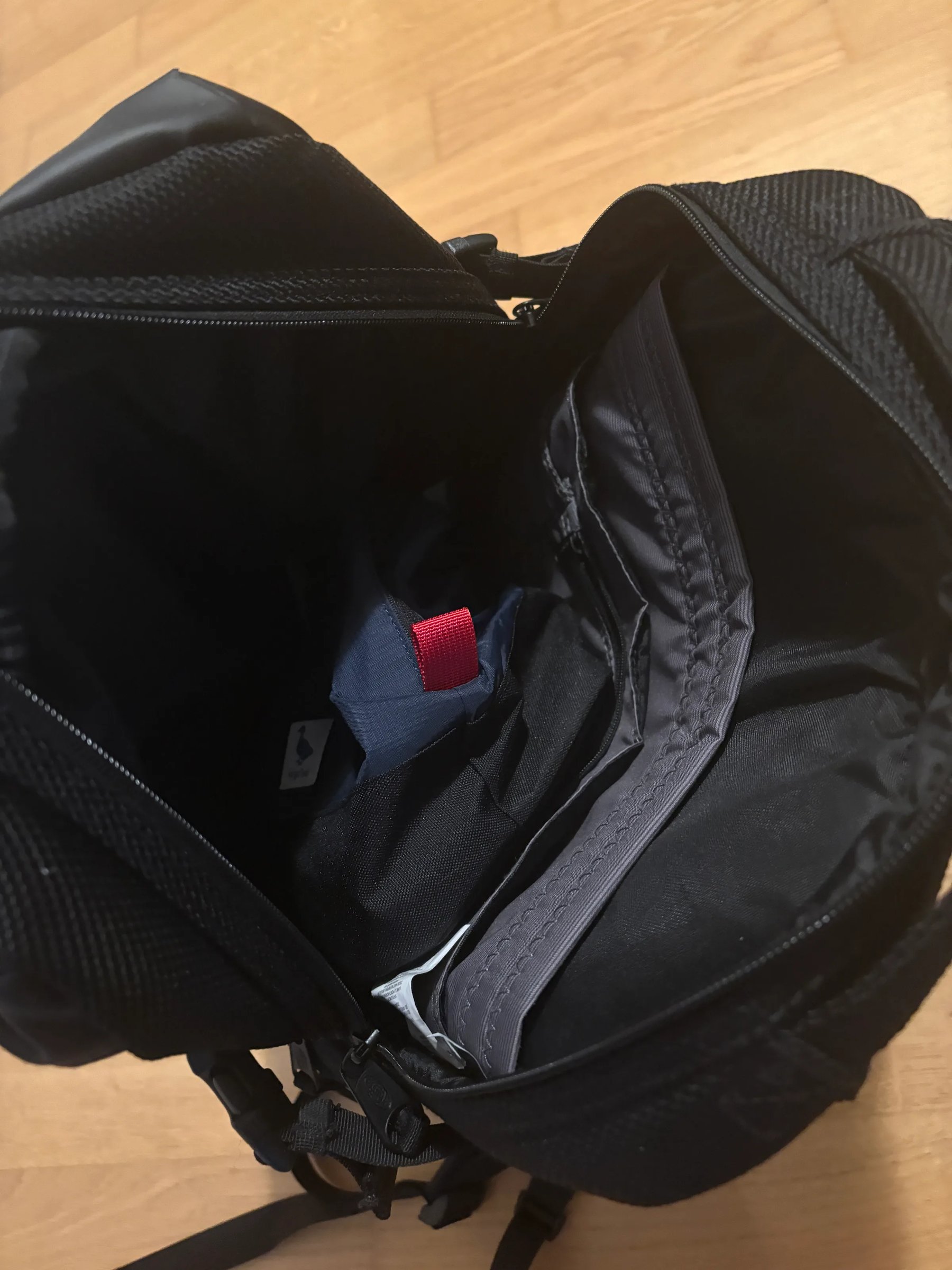 Wash bag sitting inside the office backpack